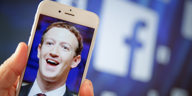 A portrait of Facebook found Mark Zuckerberg is seen on an iPhone in this photo illustration on 28 August, 2017. (Photo by Jaap Arriens/NurPhoto via Getty Images)
