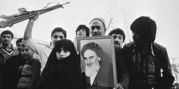 Citizens hold a portrait of Ruhollah Khomeini during a pro-Khomeini demonstration in Tehran. (Photo by Christine Spengler/Sygma/Sygma via Getty Images)