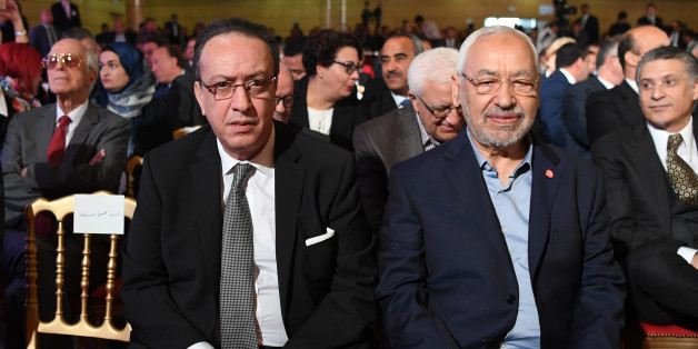 Hafedh Caid Essebsi (L), leader of Nidaa Tounes party, and Tunisian Islamist Ennahdha party leader Rached Ghannouchi, look on as they attend an official speech delivered by the Tunisian President Beji Caid Essebsi (unseen) on May 10, 2017 in Tunis.Essebsi said that the army will protect the output of Tunisia's main resources from being disrupted by protests over social and labour issues. / AFP PHOTO / FETHI BELAID (Photo credit should read FETHI BELAID/AFP/Getty Images)
