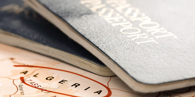 Algeria, destination marked with red color. Two passports on the map are ready for travel. The map is toned in pastel colors. Concept: Planning travel destinations or journey planning. Close-up view. Studio shot. Landscape orientation.