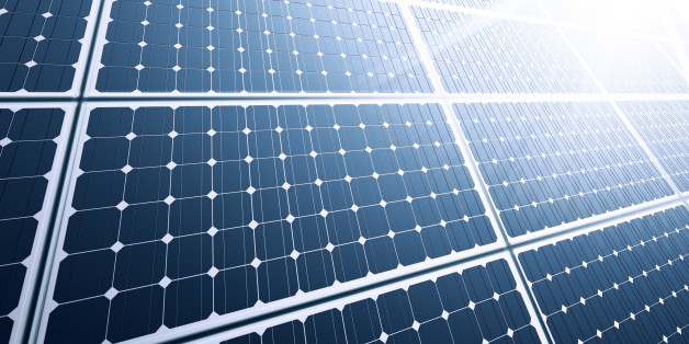 Solar panel close-up with strong sun reflection