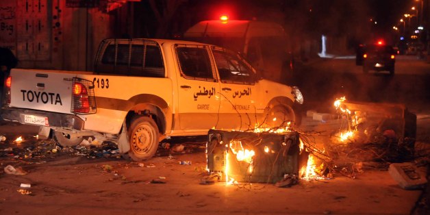 Tunisian police track down rioters in Ettadhamen on the outskirts of Tunis late on January 8, 2018 after price hikes ignited protests in the North African country. / AFP PHOTO / SOFIENE HAMDAOUI (Photo credit should read SOFIENE HAMDAOUI/AFP/Getty Images)