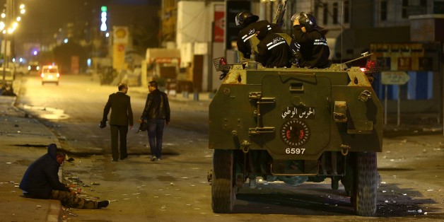 TUNIS, TUNISIA - JANUARY 09: Security forces take security measures after demonstrators burn tyres and garbage containers during a protest against price hikes, at al-Tadamun neighborhood in Tunis, Tunisia on January 09, 2018. (Photo by Yassine Gaidi/Anadolu Agency/Getty Images)