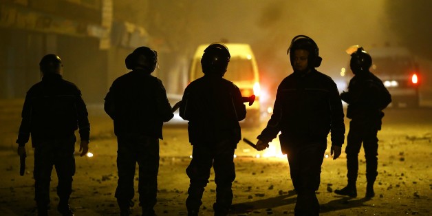 TUNIS, TUNISIA - JANUARY 09: Security forces take security measures after protesters set tires an garbage containers on fire to block a road during a demonstration against price hikes at al-Tadamun neighborhood of Tunis, Tunisia on January 09, 2018. (Photo by Yassine Gaidi/Anadolu Agency/Getty Images)