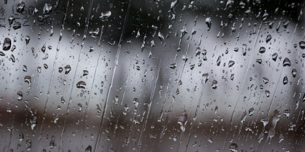 Rain drop on car glass close up background.
