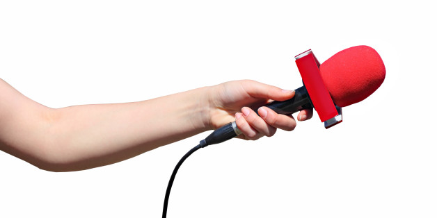 Hand with red microphone isolated on white background