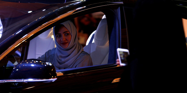 A Saudi woman is photographed as she checks a car at a showroom in Riyadh, Saudi Arabia October 5, 2017. REUTERS/Faisal Al Nasser TPX IMAGES OF THE DAY