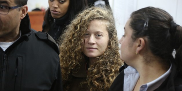 RAMALLAH, WEST BANK - JANUARY 01: The 16-year-old Palestinian Ahed al-Tamimi (2nd R), who was awarded the 'Hanzala Award for Courage' in Turkey, appears in court after she was taken into custody by Israeli soldiers, at Ofer Military Court in Ramallah, West Bank on January 01, 2018. (Photo by Issam Rimawi/Anadolu Agency/Getty Images)