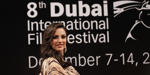 Tunisian actress Dorra Zarrouk poses as she arrives for the opening ceremony of the 8th Dubai International Film Festival December 7, 2011. REUTERS/Jumana El Heloueh (UNITED ARAB EMIRATES - Tags: ENTERTAINMENT)