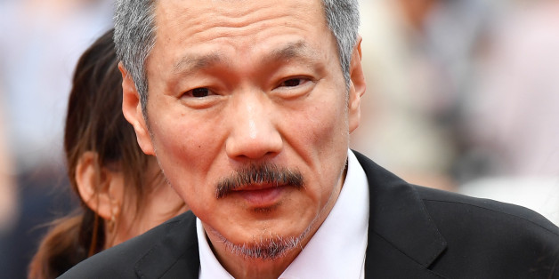 South Korean director Hong Sangsoo arrives on May 22, 2017 for the screening of the film 'Geu-Hu' (The Day After) at the 70th edition of the Cannes Film Festival in Cannes, southern France. / AFP PHOTO / Alberto PIZZOLI (Photo credit should read ALBERTO PIZZOLI/AFP/Getty Images)