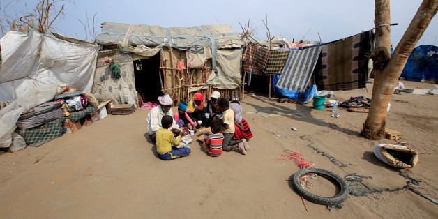 Members of Ruzaiq family sit for the breakfast outside their hut next to a garbage dump where they collect recyclables and food near the Red Sea port city of Hodeidah, Yemen, January 09, 2018. REUTERS/Abduljabbar Zeyad SEARCH "FAMILY DUMP" FOR THIS STORY. SEARCH "WIDER IMAGE" FOR ALL STORIES.