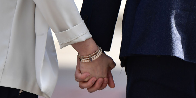 BELFAST, NORTHERN IRELAND - OCTOBER 24: Daniel McArthur (R), managing director of Ashers Bakery and his wife Amy McArthur (L) hold hands as they leave Belfast high court after losing their appeal in the so called 'Gay Cake' case on October 24, 2016 in Belfast, Northern Ireland. Ashers Bakery, a local business in Northern Ireland run by an evangelical Christian family was appealing a decision at Belfast Magistrates court last year that found that they had discriminated against gay activist Gareth