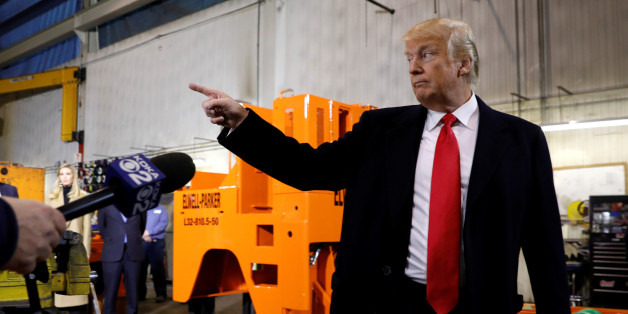 U.S. President Donald Trump gestures during a visit to H&K Equipment Company in Coraopolis, Pennsylvania, U.S., January 18, 2018. REUTERS/Kevin Lamarque
