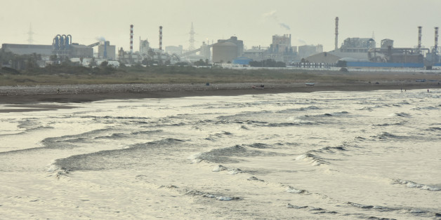 A picture shows on July 20, 2017 the state-owned Tunisian Chemical Group (GCT)'s phosphate processing plant close to the Chott Essalem beach and in front of a rare coastal oasis in Gabes.
The authorities say the plant pumps 14,000 tonnes of phosphogypsum into the sea every day. On top of the toxic mud, the factory also pumps phosphoric acid into the air. / AFP PHOTO / STRINGER (Photo credit should read STRINGER/AFP/Getty Images)