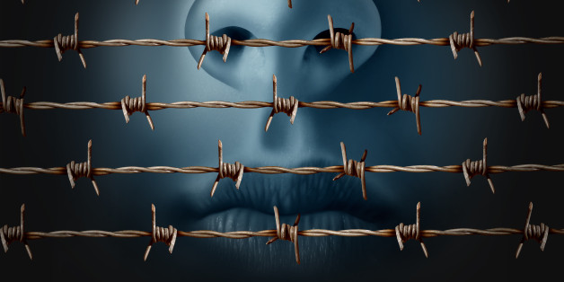 Concept of censorship and freedom of speech crisis symbol and suppression in expression of ideas icon as a human behind in old barbed wire as a metaphor for depression and social isolation in a 3D illustration style.
