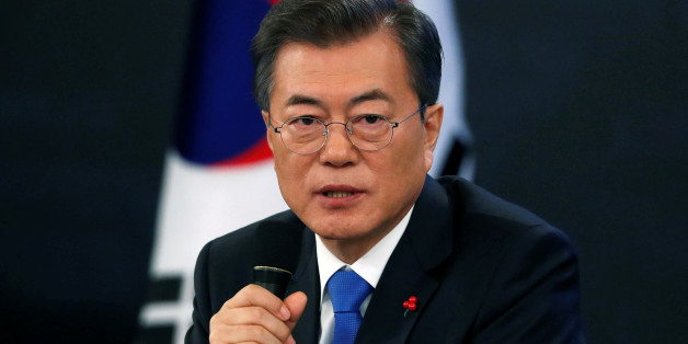 South Korean President Moon Jae-in answers reporters' question during his New Year news conference at the Presidential Blue House in Seoul, South Korea, January 10, 2018. REUTERS/Kim Hong-Ji