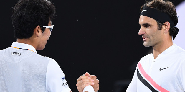 MELBOURNE, AUSTRALIA - JANUARY 26: Hyeon Chung of South Korea shakes hands with Roger Federer of Switzerland after Chung retired hurt in their semi-final match against on day 12 of the 2018 Australian Open at Melbourne Park on January 26, 2018 in Melbourne, Australia. (Photo by Quinn Rooney/Getty Images)