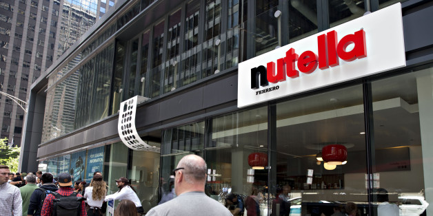 Pedestrians pass in front of the Ferrero SpA Nutella Cafe in Chicago, Illinois, U.S., on Wednesday, May 31, 2017. Ferrero SpA opened its first owned and operated permanent cafe in the world near Chicago's Millennium Park on May 31. Photographer: Daniel Acker/Bloomberg via Getty Images