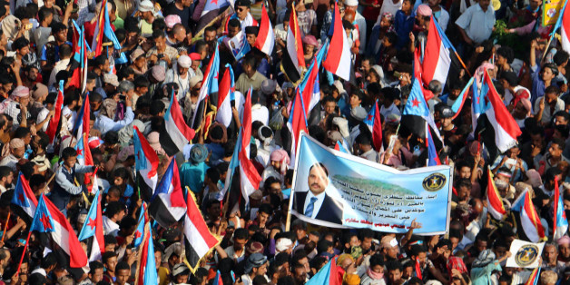 Yemeni supporters of the southern separatist movement wave the movement's flag during a rally in the southern port city of Aden, on October 14, 2017. / AFP PHOTO / STRINGER (Photo credit should read STRINGER/AFP/Getty Images)