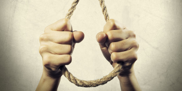 the image of the hands holding the hanging Lynch's loop on a background with texture