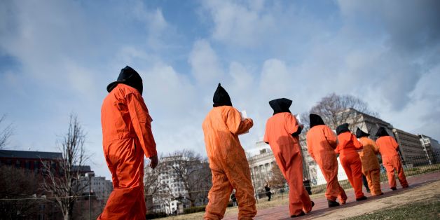Activists protest the Guantanamo Bay detention camp during a rally in Lafayette Square outside the White House January 11, 2018 in Washington, DC. / AFP PHOTO / Brendan Smialowski (Photo credit should read BRENDAN SMIALOWSKI/AFP/Getty Images)