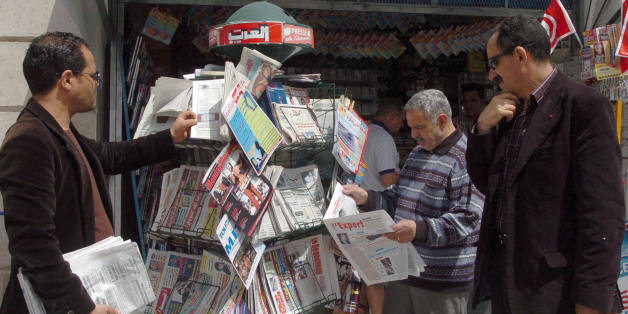 Tunisian people look at the stock of newspapers in a shop on May 03, 2008 in Tunis the international day for Press. Reporters Without Borders (RSF) media rights group., said 'Freedom of expression remains a utopia in Tunisia. All the press does is glorify the work of President Zine El Abidine Ben Ali, and independent journalists and their families are the victims of constant harrassment,' . AFP PHOTO FETHI BELAID. (Photo credit should read FETHI BELAID/AFP/Getty Images)