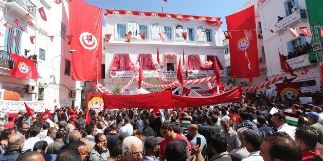 TUNIS, TUNISIA - MAY 1: People take part in a demonstration to mark May Day, International Workers' Day outside the headquarters of the Tunisian General Labour Union UGTT in Tunis, Tunisia on May 1, 2017. (Photo by Yassine Gaidi/Anadolu Agency/Getty Images)