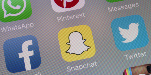 The button of Snapchat, Facebook, Twitter and other social networking Apps on the screen of a mobile phone