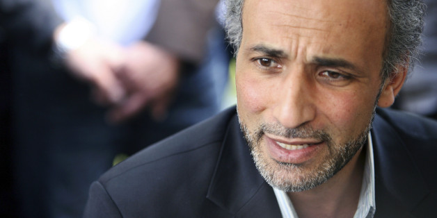 Author Tariq Ramadan talks with a journalist after a conference at the Er-Rahma mosque in Nantes, western France, April 25, 2010. Ramadan, a Swiss citizen of Egyptian origin who was born in Switzerland, has written extensively on Western Muslims and on Islam. He is president of the thinktank European Muslim Network in Brussels and teaches at Britain's Oxford University. REUTERS/Stephane Mahe (FRANCE - Tags: RELIGION PROFILE)