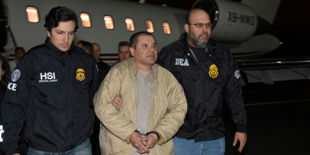 FILE PHOTO: Mexico's top drug lord Joaquin "El Chapo" Guzman is escorted as he arrives at Long Island MacArthur airport in New York, U.S., January 19, 2017, after his extradition from Mexico. Picture taken Janaury 19, 2017. U.S. officials/Handout via REUTERS ATTENTION EDITORS - THIS IMAGE WAS PROVIDED BY A THIRD PARTY. EDITORIAL USE ONLY./File Photo