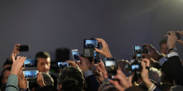 Members of the French community in Tunisia, gather to take a picture of French President Emmanuel Macron in the capital Tunis on January 31, 2018, during his first state visit to the country. / AFP PHOTO / Eric FEFERBERG (Photo credit should read ERIC FEFERBERG/AFP/Getty Images)