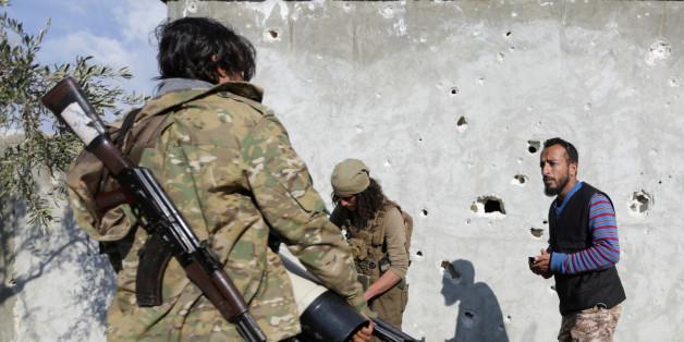 Turkish-backed Free Syrian Army fighters are seen north of the city of Afrin, Syria February 18, 2018. REUTERS/Khalil Ashawi