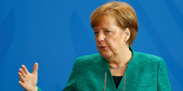 German Chancellor Angela Merkel addresses a news conference after talks with Italian Prime Minister Paolo Gentiloni in Berlin, Germany, February 16, 2018. REUTERS/Hannibal Hanschke