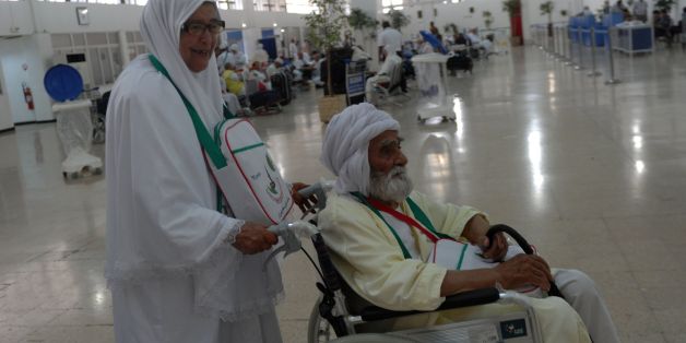 Algerian pilgrims arrive at Algiers airport on August 29, 2016, for their departure to the annual Hajj pilgrimage in the Islamic holy cities of Mecca and Medina in Saudi Arabia.The Hajj, the largest annual pilgrimage in the world, is the fifth pillar of Islam, a religious duty that must be carried out at least once in the lifetime of every able-bodied Muslim who can afford to do so. / AFP / RYAD KRAMDI (Photo credit should read RYAD KRAMDI/AFP/Getty Images)