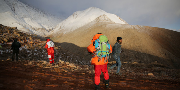 Members of emergency and rescue team search for the plane that crashed in a mountainous area of central Iran, February 19, 2018. REUTERS/Tasnim News Agency ATTENTION EDITORS - THIS PICTURE WAS PROVIDED BY A THIRD PARTY.