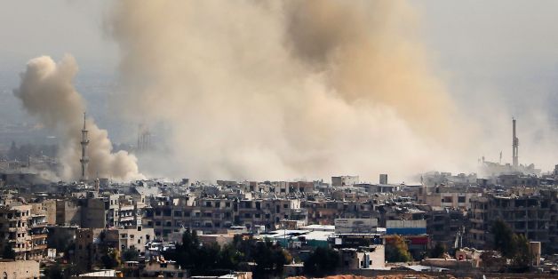 A picture taken from a government-controlled area on the outskirts of Harasta on the northeastern suburbs of Damascus on February 21, 2018, shows smoke rising from areas targeted by Syrian army shelling in the towns of Arbin and Harasta. / AFP PHOTO / - (Photo credit should read -/AFP/Getty Images)