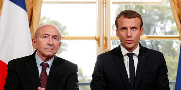 French President Emmnauel Macron (R) addresses the medias with French Interior Minister Gerard Collomb (L) after signing a new anti-terrorism and interior security law at the Elysee Palace in Paris, France, October 30, 2017. REUTERS/Christophe Ena/Pool