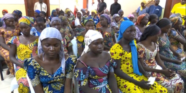 FILE PHOTO - A still image taken from video shows a group of girls, released by Boko Haram jihadists after kidnapping them in 2014 in the north Nigerian town of Chibok, sitting in a hall as they are welcomed by officials in Abuja, Nigeria, May 7, 2017. REUTERS/via Reuters TV