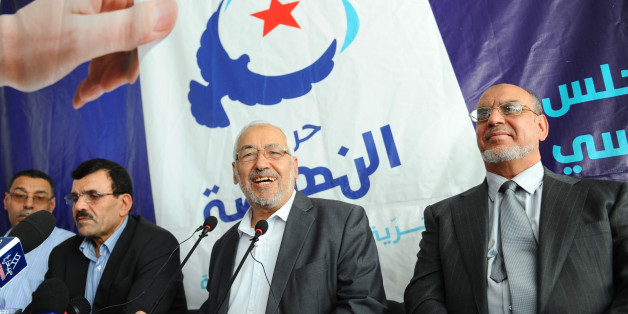 Leader and founder of Ennahdha Islamist movement, Rached Ghannouchi (C), flanked by his general secretary Hamadi Jebali (R) and Ennahdha Assembly President Ali Laaraiedh (L), gives a press conference on October 19, 2011 in Ariana near Tunis. Tunisia's first post-revolution polls risk being rigged, the Islamist party leading opinion polls warned Wednesday, vowing a fresh uprising if vote was marred by fraud. 'There is a risk of the election results being manipulated,' Ennahda leader Rached Ghanno