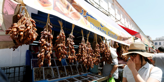 A women looks at dates on the first day of the holy fasting month of Ramadan at a market in Tunis, Tunisia, May 27, 2017. REUTERS/Zoubeir Souissi