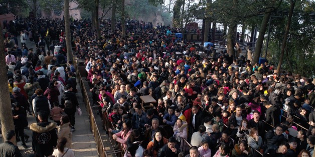 LESHAN, CHINA - FEBRUARY 20: Tourists visit the Leshan Giant Buddha on February 20, 2018 in Leshan, Sichuan Province of China. Thousands of tourists waited about four hours to see the Leshan Giant Buddha on the fifth day of Chinese lunar new year. (Photo by Liu Zhongjun/Chinese News Service/VCG via Getty Images)
