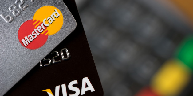 Bangkok, Thailand - May 24, 2016: Closeup of VISA and MASTER credit cards on the credit card machine.