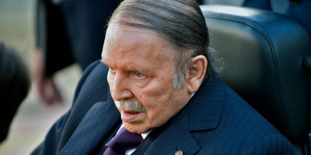 Algerian President Abdelaziz Bouteflika is seen heading to vote at a polling station in Algiers on November 23, 2017 as Algeria goes to the polls for local elections. / AFP PHOTO / RYAD KRAMDI (Photo credit should read RYAD KRAMDI/AFP/Getty Images)