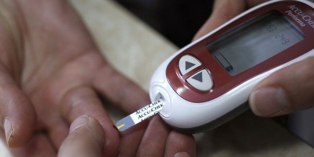 A patient takes a blood glucose test during an event aimed to help people with diabetes to cope with their illness at Saint Luka diagnostics medical center in Sofia, November 13, 2012. Picture taken November 13, 2012. REUTERS/Stoyan Nenov (BULGARIA - Tags: HEALTH)
