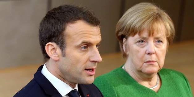 BRUSSELS, BELGIUM - FEBRUARY 23: German Prime Minister Angela Merkel (R) and French President Emmanuel Macron (L) answer the questions of press members as they arrive to attend the EU members' informal meeting of the 27 heads of state or government at European Council headquarters in Brussels, Belgium on February 23, 2018. (Photo by Dursun Aydemir/Anadolu Agency/Getty Images)