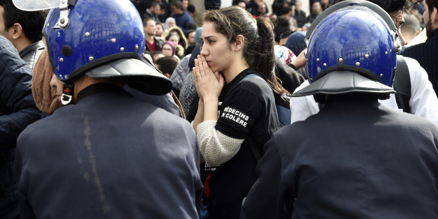 Algerian anti riot police surround doctors and dentists who are completing their residency stage of their studies during a sit-in outside La Grande Poste in the capital Algiers, on February 12, 2018, as part of a three-month-long strike protesting against compulsory civil service. / AFP PHOTO / RYAD KRAMDI (Photo credit should read RYAD KRAMDI/AFP/Getty Images)