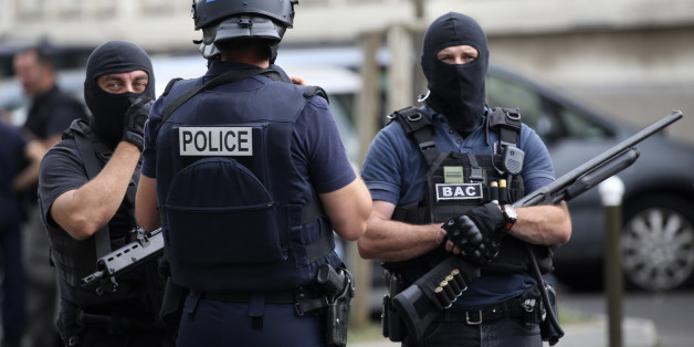 French police and anti-crime brigade (BAC) secure a street they carried out a counter-terrorism swoop at different locations in Argenteuil, a suburb north of Paris, France, July 21, 2016. REUTERS/Charles Platiau