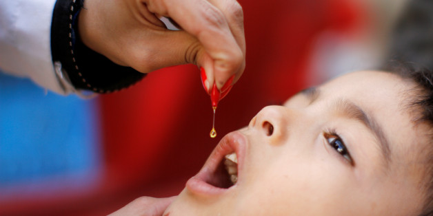 A boy is administered vitamin A drops during a house-to-house anti-polio vaccination campaign in Sanaa, Yemen October 23, 2017. REUTERS/Mohamed al-Sayaghi