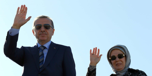 ALGIERS, ALGERIA - NOVEMBER 20: Turkish President Recep Tayyip Erdogan and First Lady Emine Erdogan greet the Algerian officials during their departure from Algeria to go Equatorial Guinea for the Second Turkey-Africa Partnership Summit, in Algiers on November 20, 2014. (Photo by Kayhan Ozer/Anadolu Agency/Getty Images)