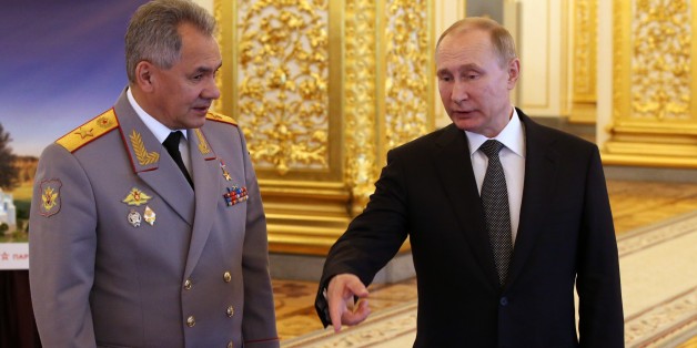 MOSCOW, RUSSIA - FEBRUARY 23: (RUSSIA OUT) Russian President Vladimir Putin (R) and Defence Minister Sergei Shoigu (R) are seen during an awarding ceremony marking the Defender of the Fatherland's Day at the State Kremlin Palace in Moscow, Russia, February 23, 2018. Russians celebrate the Defender of the Fatherland's Day, also know as the Day of Soviet Army in the past. (Photo by Mikhail Svetlov/Getty Images)